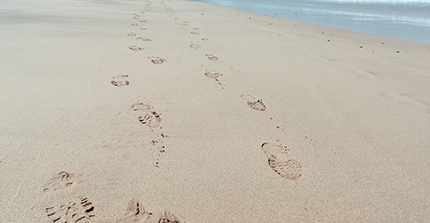 shoeprints on a sandy beach