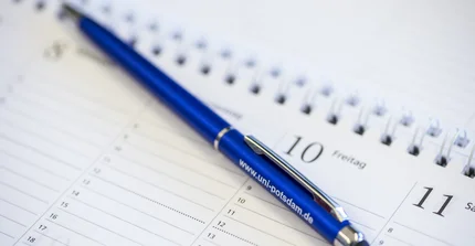 Kalender mit Stift