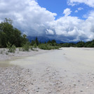 Small summer flood on the wide gravel river bed of the Isar at Wallgau