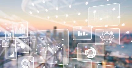 Beispielbild: technische Grafiken vor Hintergrund einer Stadt