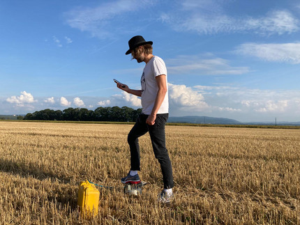 Walter Düsing in the field performing measurements