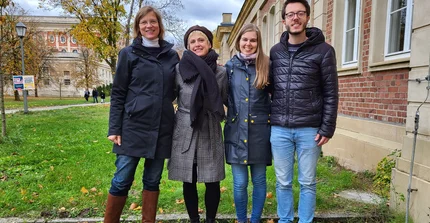 Group picture of Prof. Anja Linstädter, MSc student Helen Schroeter, Phd student Lisa-Maricia Schwarz and NamTip project manager Thomas Bringhenti, outdoors in front of a university building