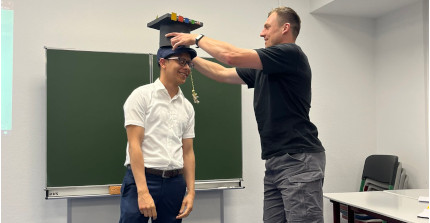 Omar receives his doctoral hat